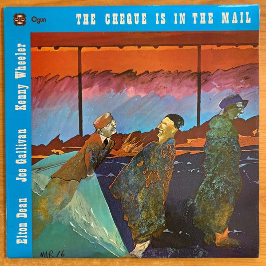 Elton Dean, Joe Gallivan, Kenny Wheelere - The Check Is In The Mail / 1. UK Press. 1977 - (M-/M-)