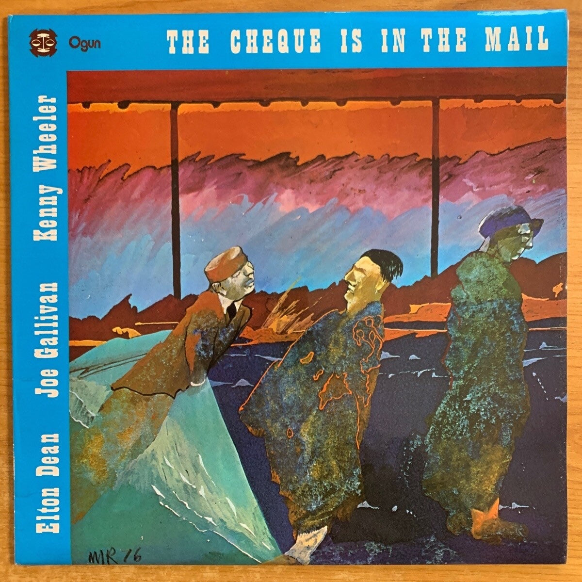 Elton Dean, Joe Gallivan, Kenny Wheelere - The Check Is In The Mail / 1. UK Press. 1977 - (M-/M-)