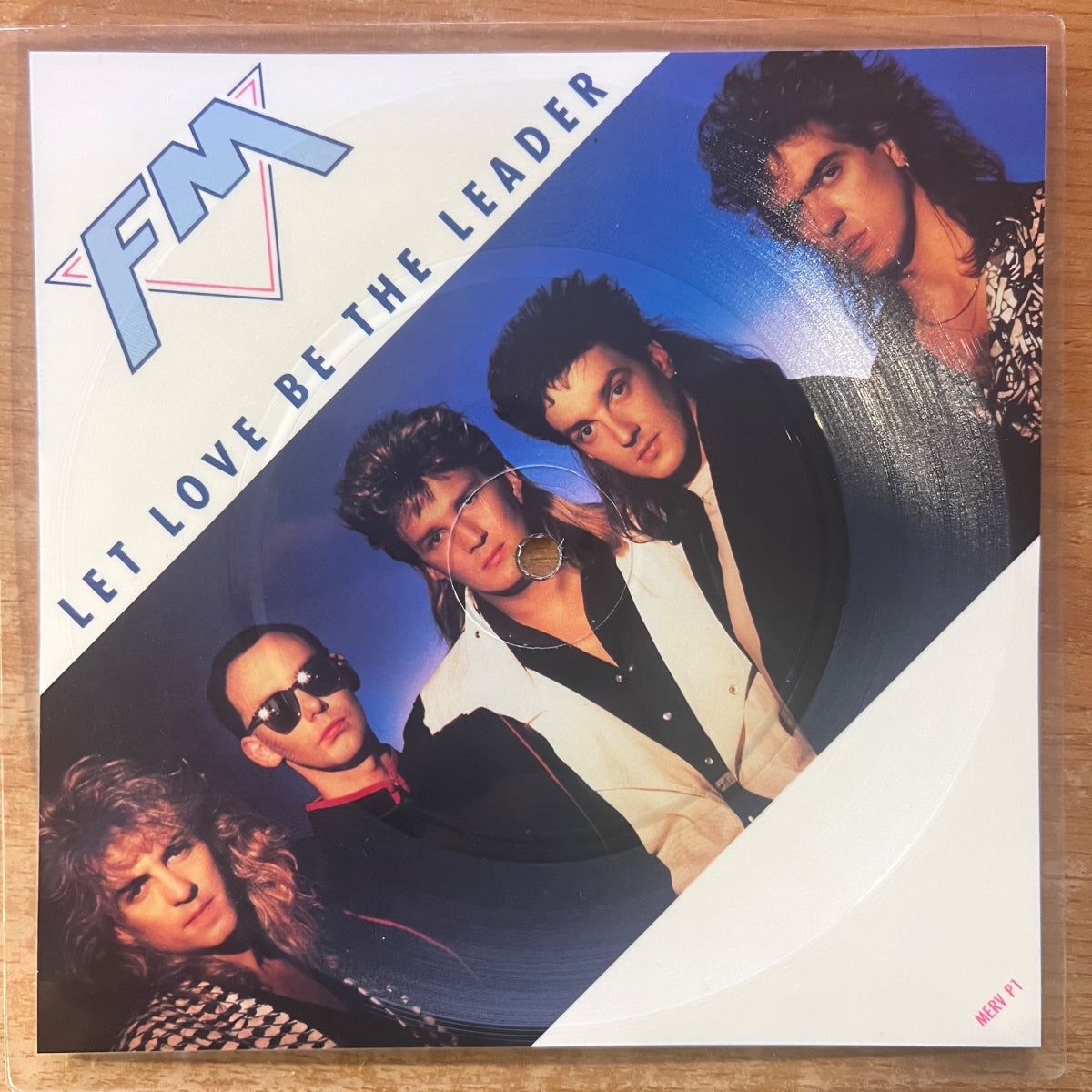 FM - Let Love Be The Leader / 45 tours picture disc - Première édition britannique. 1987 - (Très bon état / Pochette originale en plastique)